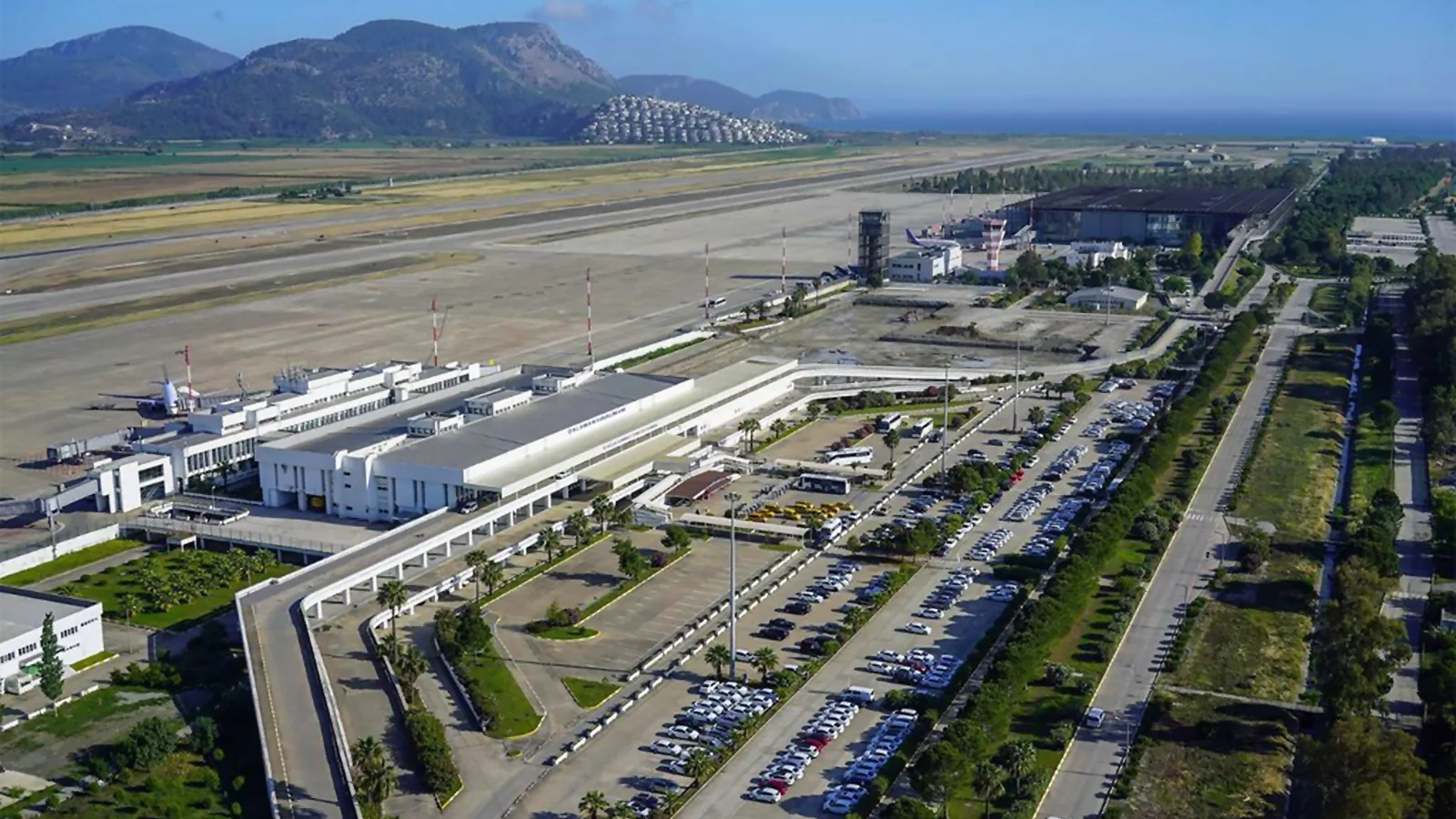 A Havaş, Muttaş, taxi, or private transfer vehicle heading from Dalaman Airport to Gocek. Easy and fast transportation options to Gocek.